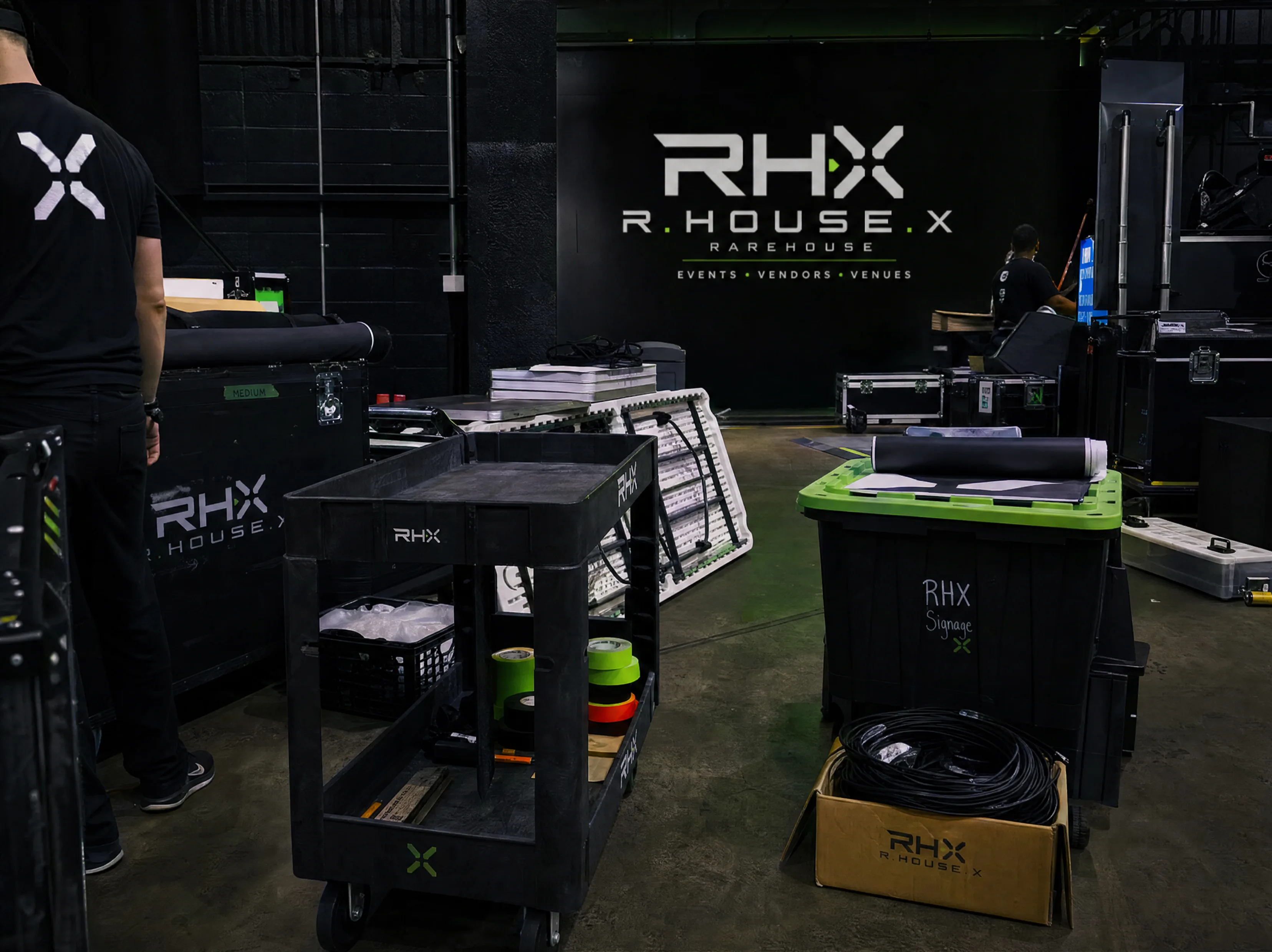 Load-in and signage prep behind the scenes at an RHX event